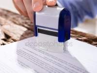 depositphotos_161932270-stock-photo-person-stamping-document